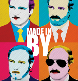 Grafika z czterema twarzami mężczyzn. Na środku napis: "Made in by".